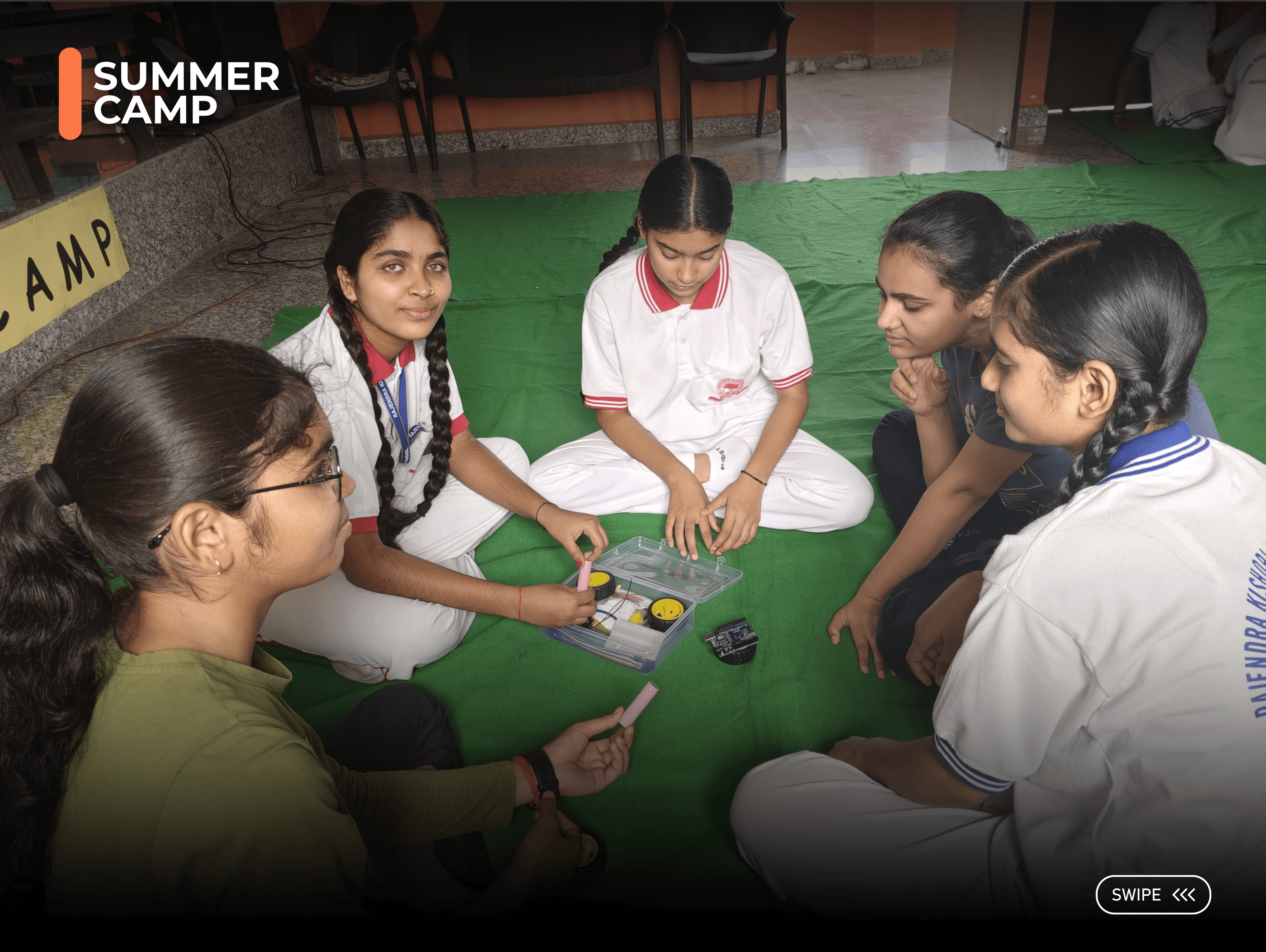 Students collaborating during the robotics summer camp